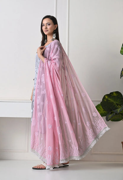Woman wearing a pink dupatta with a white background