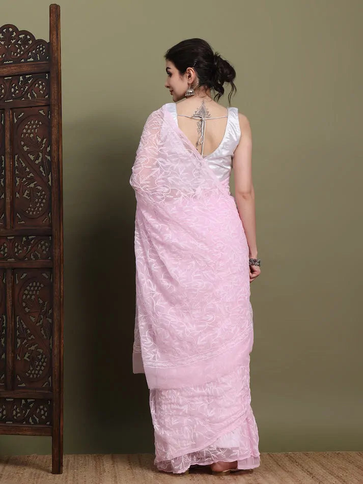 Back view of exclusive baby pink Tepchi hand-made Chikankari saree with detailed pallu 