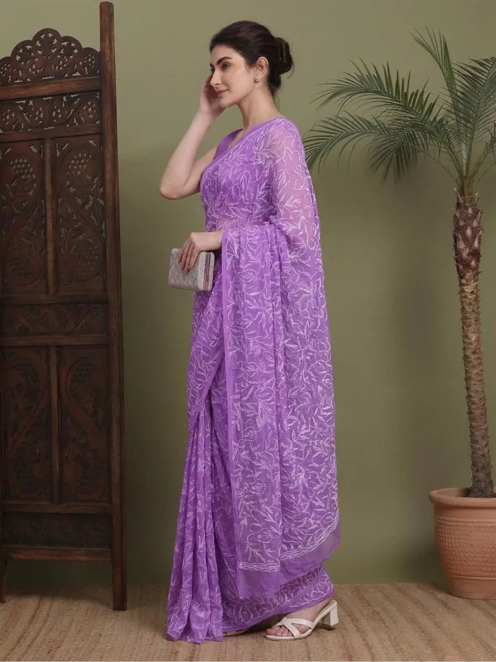 Angled view of exclusive Dark Purple hand-embroidered Tepchi Chikankari saree