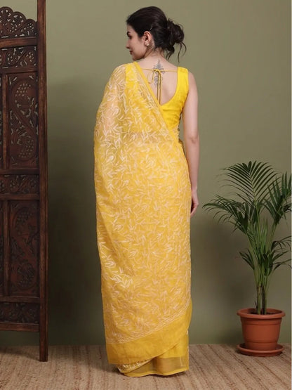 Back view of exclusive dark yellow Tepchi hand-made Chikankari saree for women