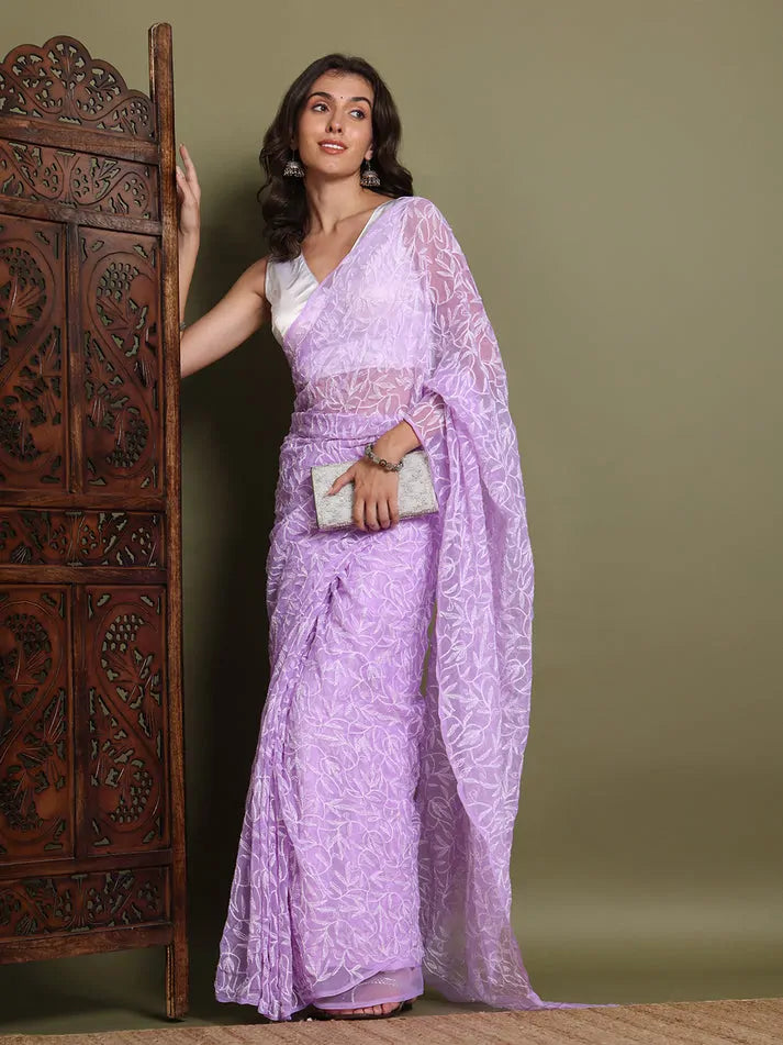 Lifestyle view of women wearing exclusive lavender Tepchi Chikankari saree