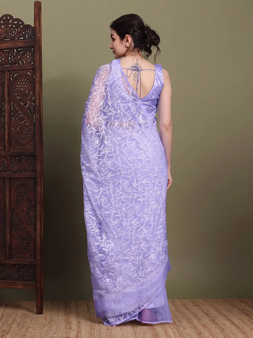 Back view of exclusive light lavender Tepchi hand-made Chikankari saree with detailed pallu