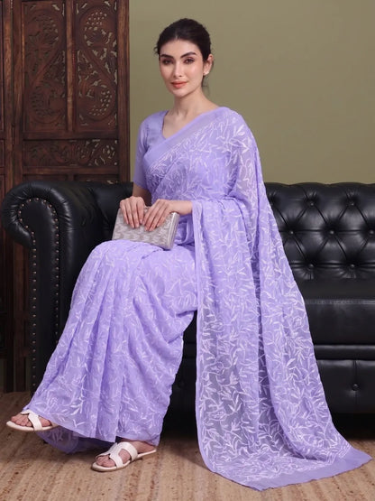 Seated view of exclusive light lavender Tepchi hand-made Chikankari saree for women
