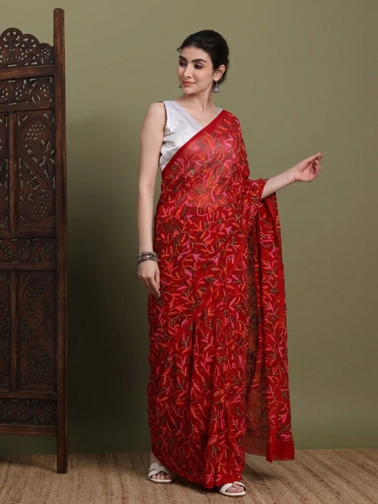 Side view of exclusive multi red Tepchi hand-made Chikankari saree for women