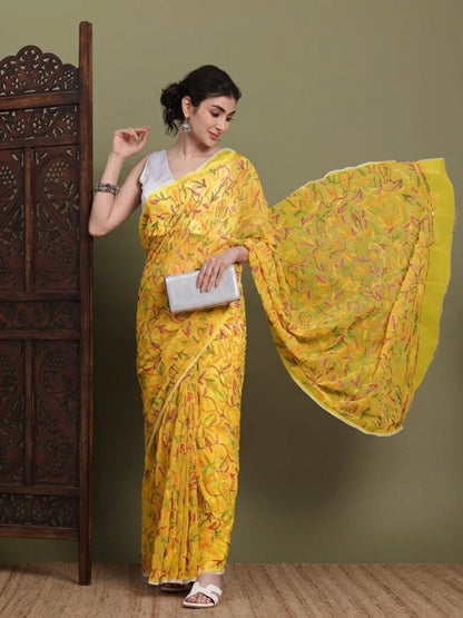 Angled view of exclusive multi yellow Tepchi hand-made Chikankari saree for women