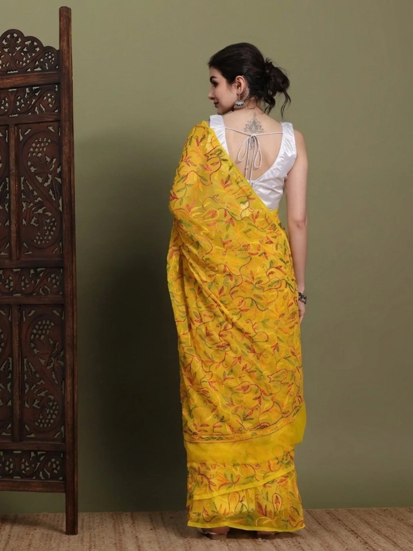 Back view of exclusive multi yellow Tepchi hand-made Chikankari saree for women