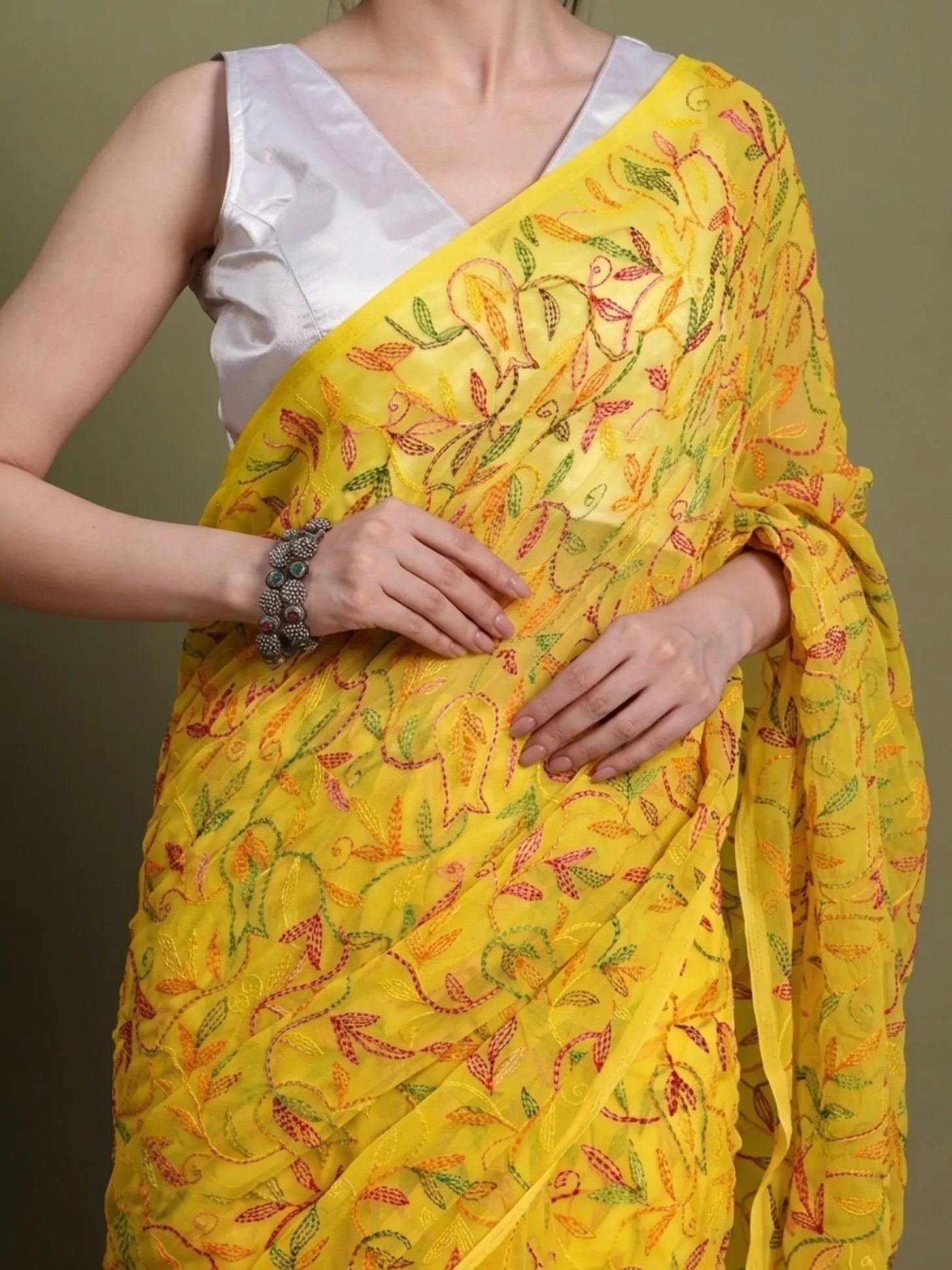 Closeup view of exclusive multi yellow Tepchi hand-made Chikankari saree for women