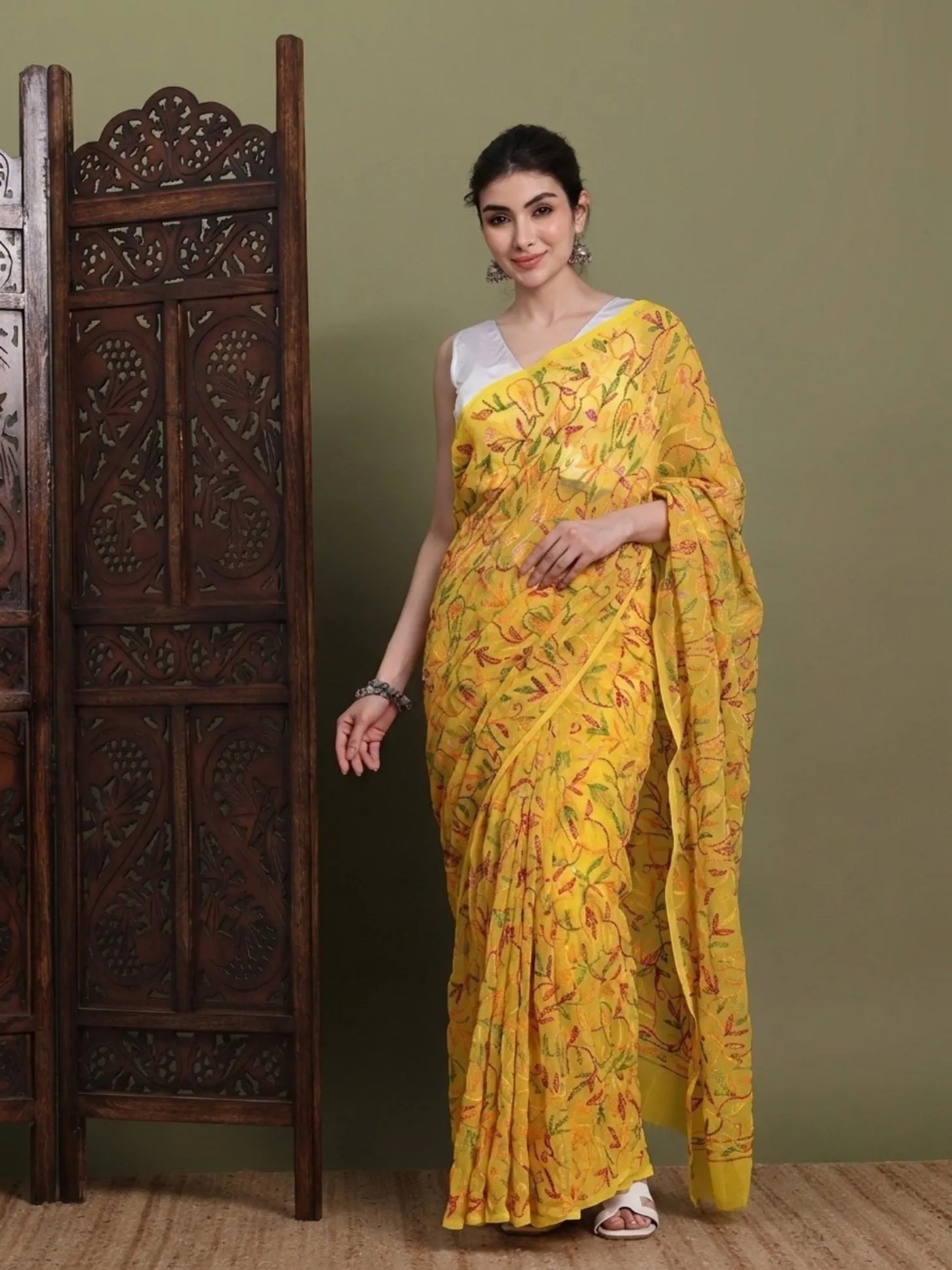 Front view of exclusive multi yellow Tepchi hand-made Chikankari saree for women