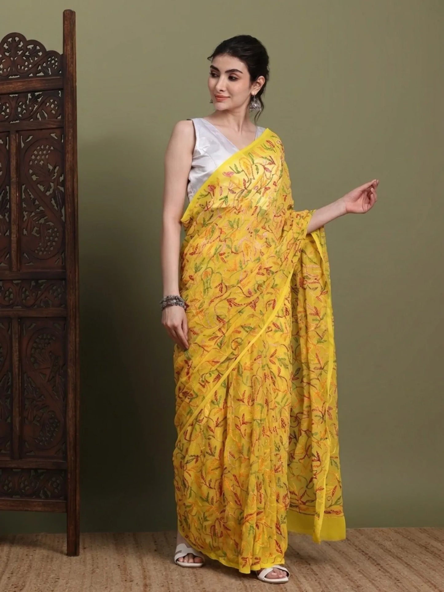 Side view of exclusive multi yellow Tepchi hand-made Chikankari saree for women