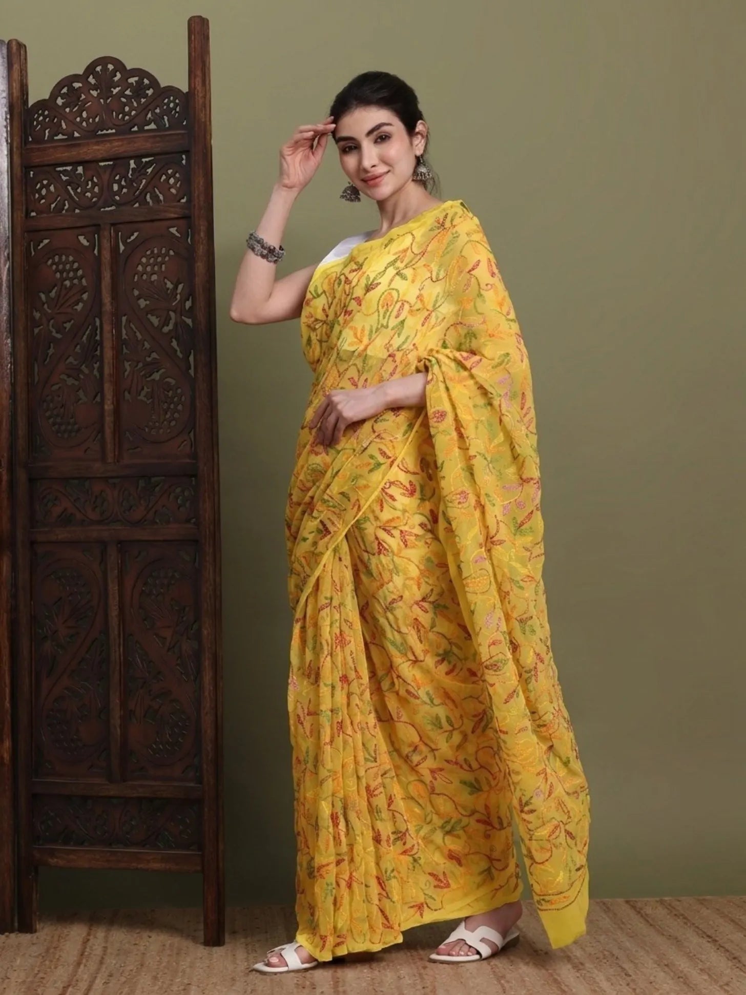 Sided view of exclusive multi yellow Tepchi hand-made Chikankari saree for women