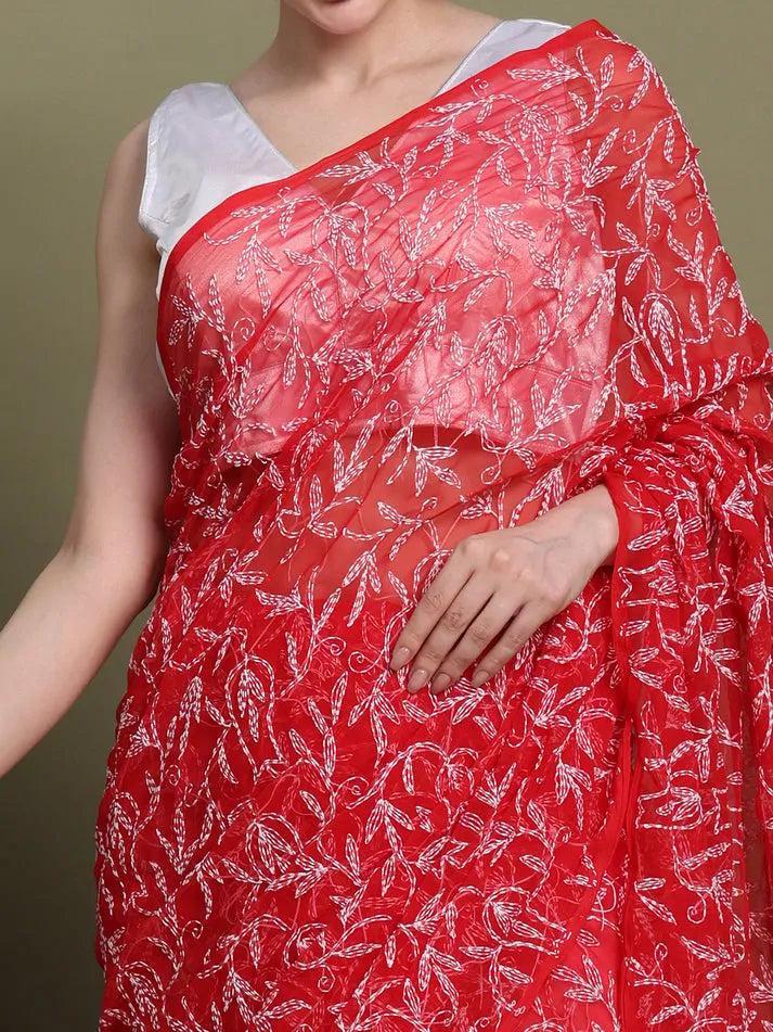 Close-up embroidery detail of exclusive red Tepchi hand-made Chikankari saree