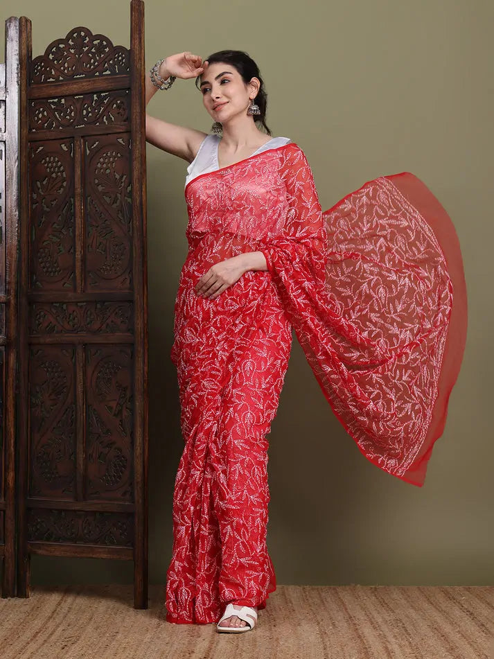 Elegant pallu display of exclusive red hand-made Tepchi Chikankari saree
