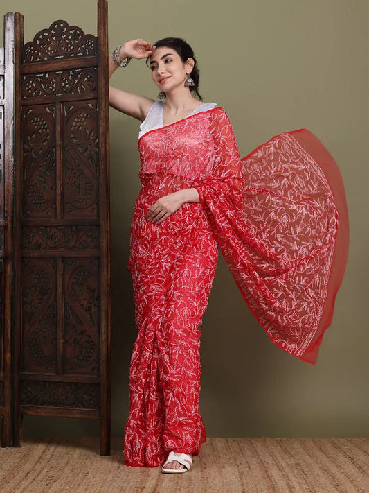 Elegant pallu display of exclusive red hand-made Tepchi Chikankari saree