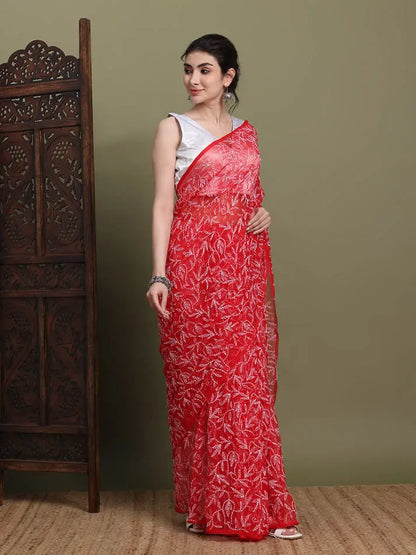 Side profile view of exclusive red Tepchi Chikankari saree
