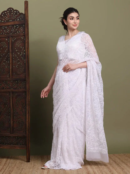 Angled view of exclusive white hand-embroidered Tepchi Chikankari saree