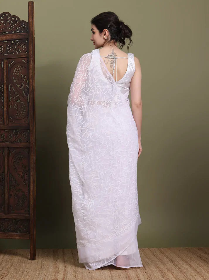 Back view of exclusive white Tepchi hand-made Chikankari saree with detailed pallu