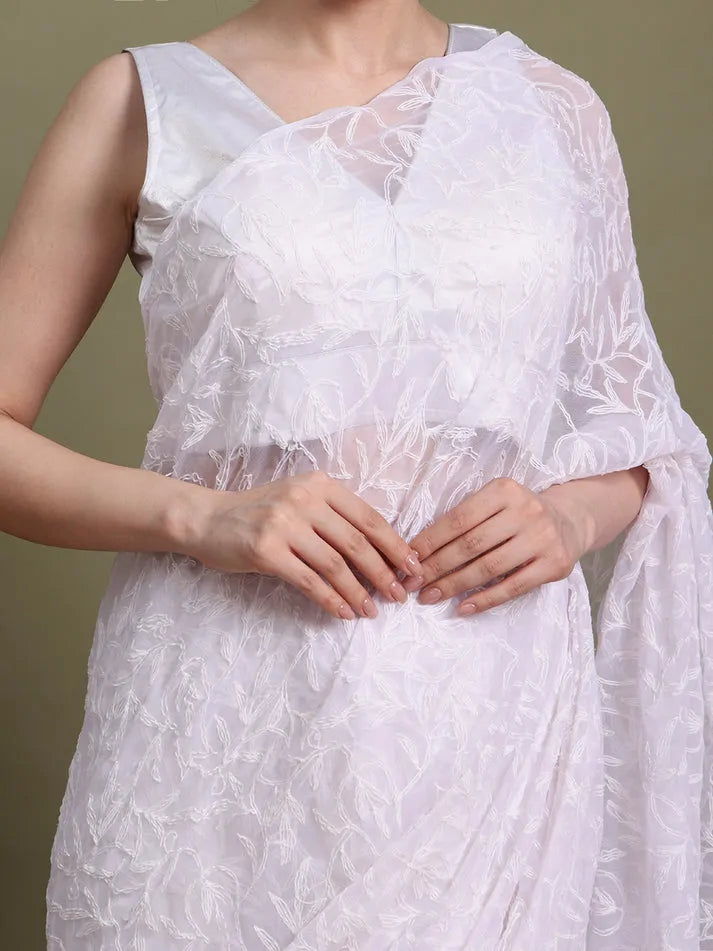 Close-up embroidery detail of exclusive white hand-crafted Tepchi Chikankari saree