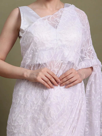 Close-up embroidery detail of exclusive white hand-crafted Tepchi Chikankari saree