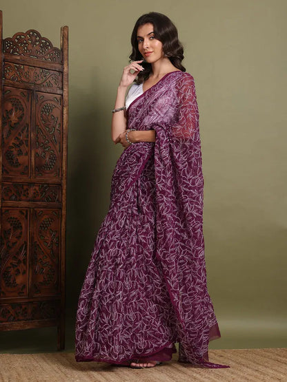 Angled view of exclusive wine hand-embroidered Tepchi Chikankari saree