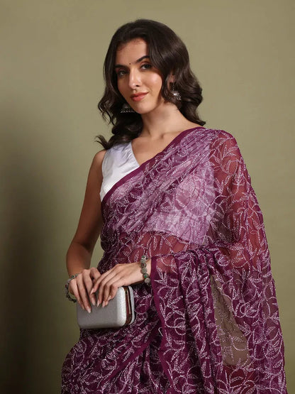 Model pose wearing exclusive wine hand-embroidered Tepchi Chikankari saree