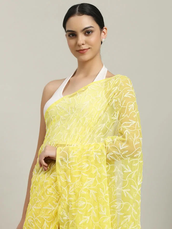lose-up embroidery detail of exclusive yellow hand-crafted Tepchi Chikankari saree