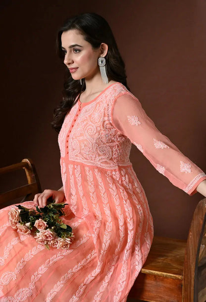 Lifestyle close up view of women's peach embroidered anarkali kurta
