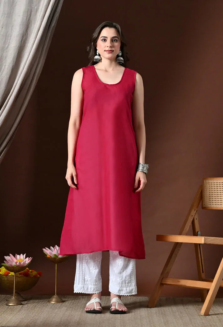 Women's pink cotton anarkali kurta set with white pants front view ethnic wear