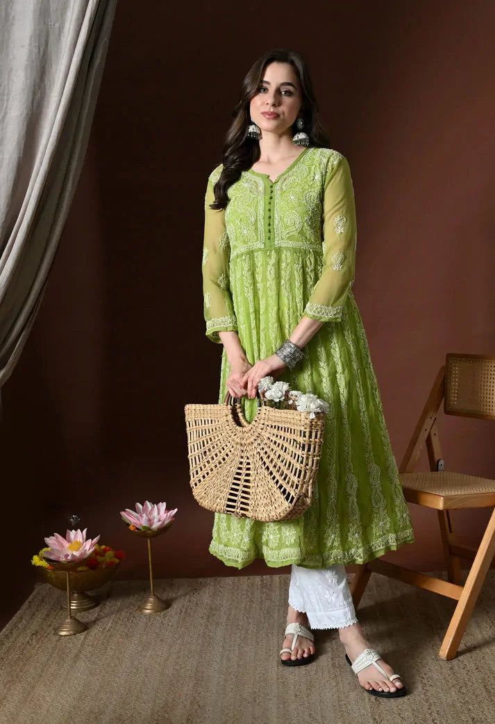 Lifestyle view of pistachio green embroidered anarkali kurta set for women