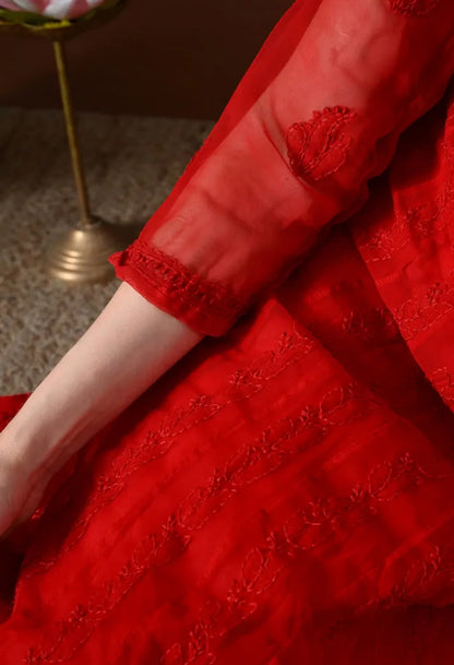 Closeup of red Anarkali kurti sleeve embroidery and fabric detailing