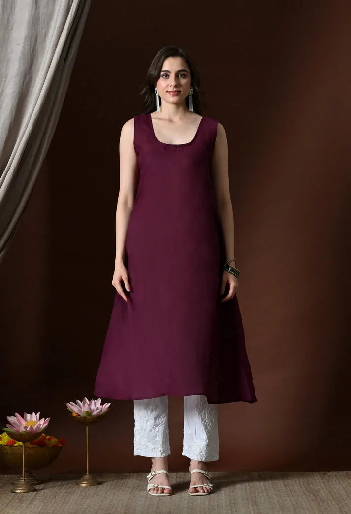 Wine colour Anarkali kurti sleeveless inner layer front view with white pants