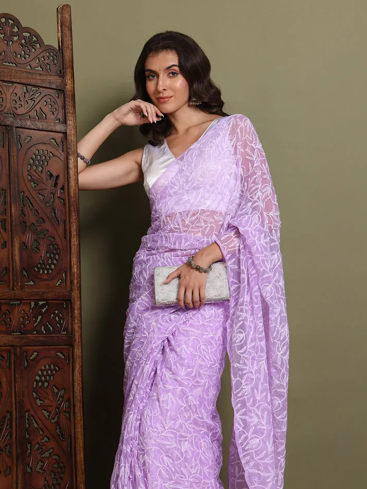 Model pose wearing exclusive lavender hand-made Chikankari saree